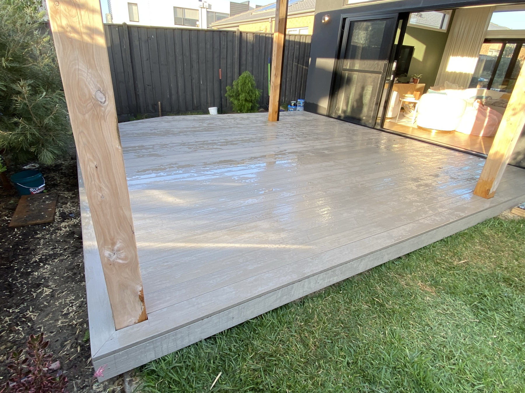 Composite decking with timber pergola posts
